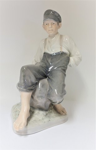 Royal Copenhagen. Sitting shepherd. Model 1659. Height 31 cm. (1 quality)