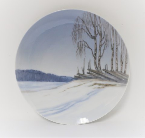 Royal Copenhagen. Porcelain plate. Model 1285/1120. Snow landscape. Diameter 20 
cm. (2 quality)