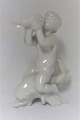 Bing & Grøndahl. Porcelænsfigur. Kai Nielsen. Havbarn på delfin, blanc de chine. 
Højde 18 cm. (1 sortering)