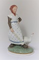 Royal Copenhagen. Porcelain figure. Goose girl in colors. Model 528. Height 18.5 
cm. (1 quality)