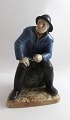 Royal Copenhagen. Porcelænsfigur. Den gamle fisker fra Skagen. Model 489. (1 
sortering). Højde 21 cm.