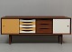 flot lav teak skænk med vendbare låger, designet af Bruno Hansen. JP Design. Fritstående.H 70cmBredde 180cmD 42cmLevering:Jylland/Fyn(månedligt) 500krSjælland(ugentlig) 300kr
